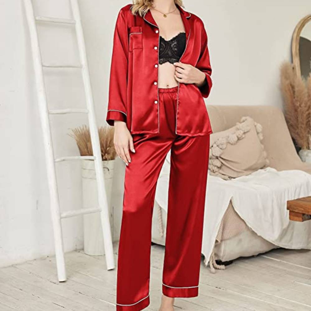 Woman in the red satin pyjama set, standing